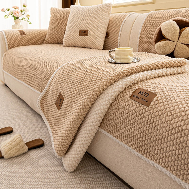 Close-up of the Coffee Fur & Haven SofaShield cover's bead texture and rope edge