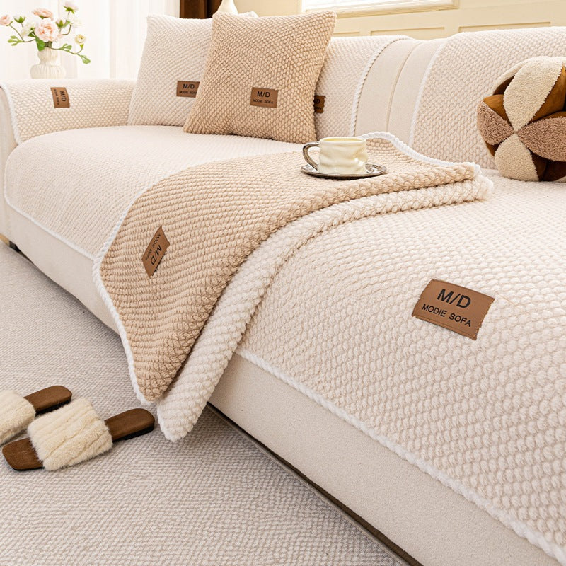 Close-up of the White Fur & Haven SofaShield cover's bead texture and rope edge